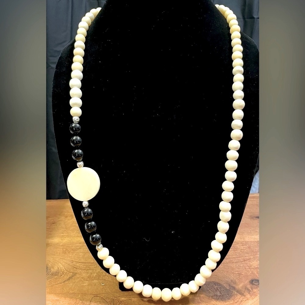 Carved bone and onyx bead necklace​​​​​​